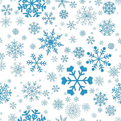 A seamless pattern of various blue snowflakes on a white background with a calming and wintry mood.