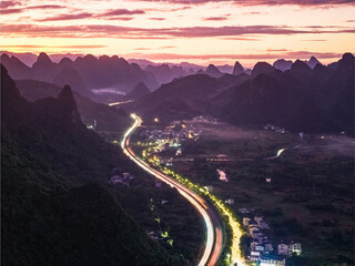 the road to the mountains in sunset