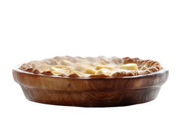 Freshly baked apple pie with golden crust and warm apple slices resting in a wooden bowl on a clean surface