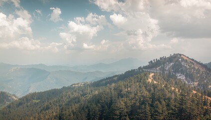 Fototapeta premium Wide-angle perspective of mountain peaks from a high-altitude trail