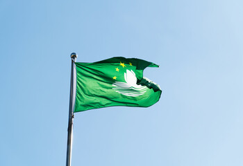 Regional Flag of the Macau in the blue sky