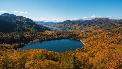 Naklejka premium Aerial view of a serene autumnal lake encircled by colorful foliage