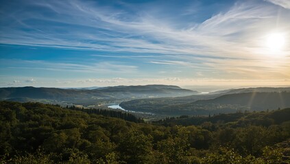 Naklejka premium Scenic View Featuring a Cloudy Sky Above the Terrain