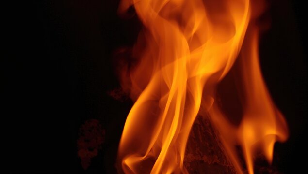 Glowing fire burning brightly in a dark fireplace setting, perfect for firefighter safety visuals, creative wallpaper texture with dynamic flame motion