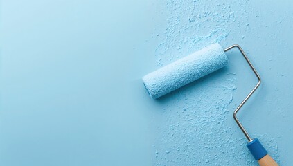 Obraz premium Worker applying blue paint on wall with roller brush during apartment renovation, ample white space for text