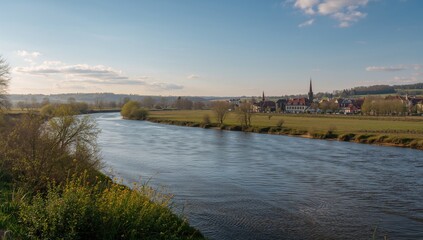 Fototapeta premium Springtime Scene Along a River in a Small Town in Northern Germany