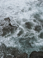 Raw Energy of Ocean Waves Colliding with Sharp Coastal Rocks