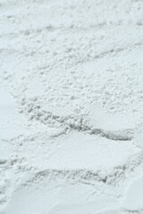 Texture of dry talcum powder as background, closeup