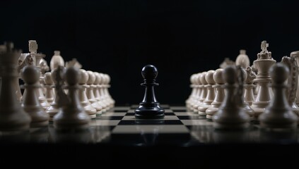 Close-up of a single black chess pawn surrounded by white pieces on a chessboard against a dark backdrop, symbolizing competition and leadership growth.