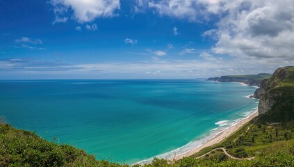 Fototapeta premium Seaside panorama with cliffs and open sky, featuring beach and ocean scenery in summer