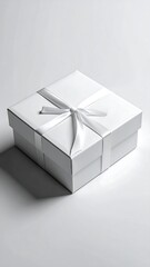 Elegant white gift box tied with a satin ribbon, casting a subtle shadow on a plain backdrop