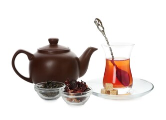 Traditional Turkish tea, dry leaves and sugar isolated on white