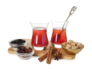 Traditional Turkish tea, dry leaves, cinnamon sticks, anise star and sugar isolated on white