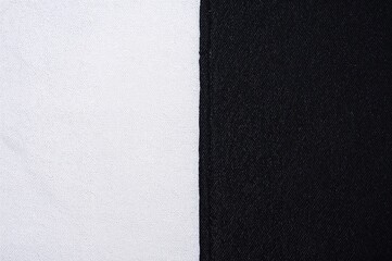 Fototapeta premium Vintage black denim fabric texture on white backdrop