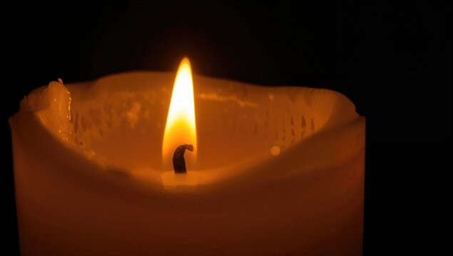 Detailed view of a burning candle wick.