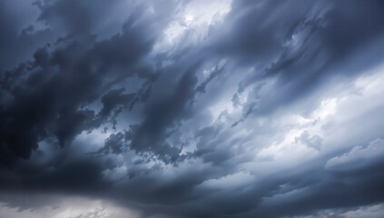 Obraz premium The menacing clouds formed a powerful and eerie atmosphere, producing a shadowy and surreal backdrop as the air brimmed with the feeling of an approaching catastrophe during the stormy season