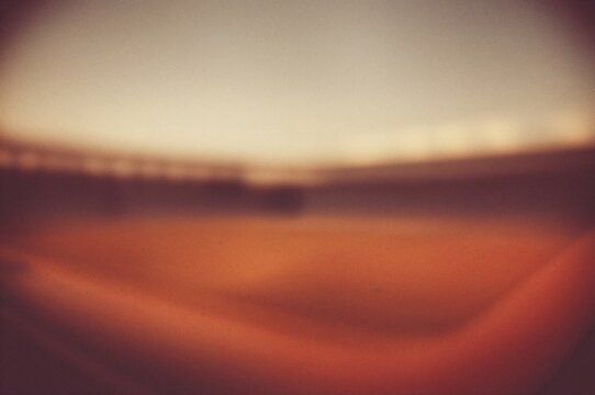 Digital image featuring abstract brown stadium lights with a blurred effect