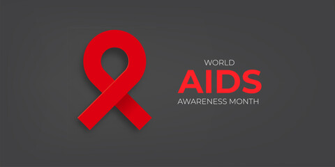 World AIDS awareness month banner with red ribbon. World HIV awareness month starts in December. Red ribbon with text isolated on grey background. World AIDS Day December 1st