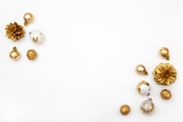 White Christmas background with copy space and golden decorations. Stylish minimalist composition for cards, banners and holiday ads.
