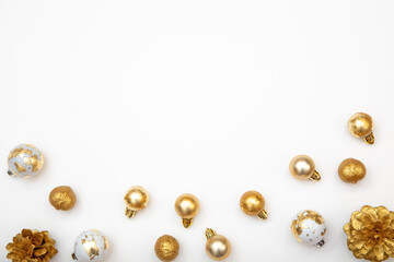 Modern New Year background in white and gold tones. Decorations on the sides form a frame and leave free copy space in the center.