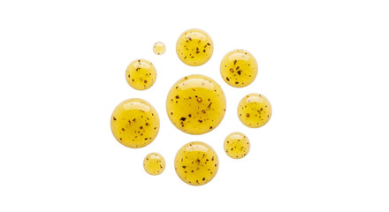 Obraz premium Droplets of yellow liquid with brown specks arranged in a circular pattern