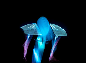 Long exposure of brightly lit objects floating in the night sky