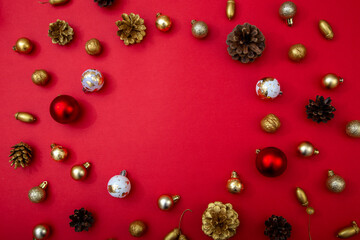Elegant Christmas composition with golden accents on red background. Luxury festive background for banners and brand greetings.