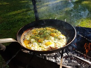 Egg in the forest on a campfire