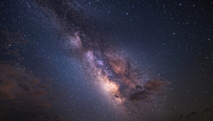 Fototapeta premium Stars and the Milky Way illuminate the nighttime sky