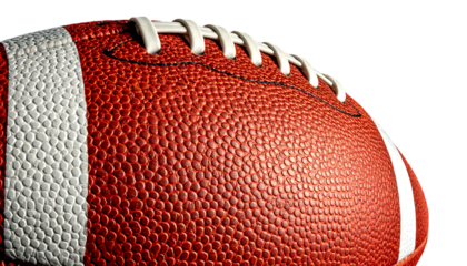 Close-up of textured American football, showing the laces and stripes against a dark background