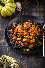 Halloween dish black pasta with bolognese