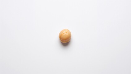 Uncooked Chickpeas Separated on a Plain White Surface
