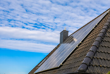 Solar panels generating sustainable energy on a house roof