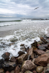 boulders and wooden breakwaters on the beach