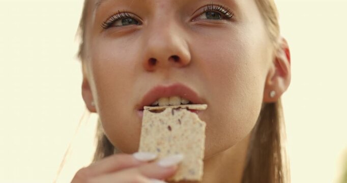 Enjoying a delicious snack outdoors under the clear sky during a sunny afternoon