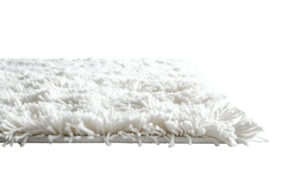 Side profile view of a fluffy white rectangular rug with a dark background