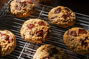 dark chocolate chunk oatmeal cookies on cooling rack.