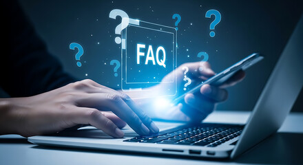 Person typing on laptop and holding smartphone with glowing faq interface and question marks.