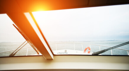 Close-up of a yacht closed porthole with ocean view