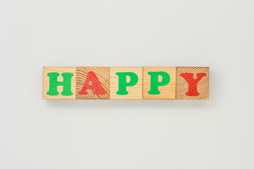 Happy Word Made of Wooden Cubes
