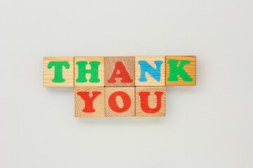 Wooden Letter Cubes Arranged as Thank you