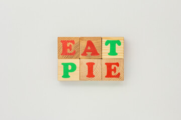 Wooden Cubes Displaying phrase Eat Pie