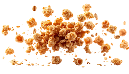 Aerial shot of caramelized popcorn and peanut pieces scattered on a black background