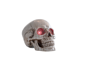 Single antique skull featuring eerie glowing red eyes with spooky halloween vibe isolated on white background