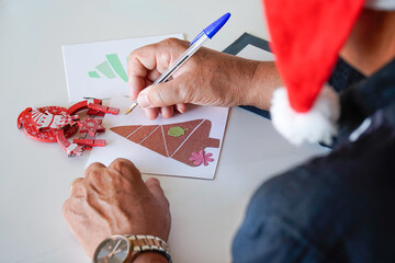 writing Christmas postcard