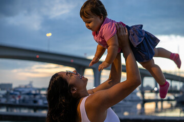 Beautiful mom and little daughter having a great time
