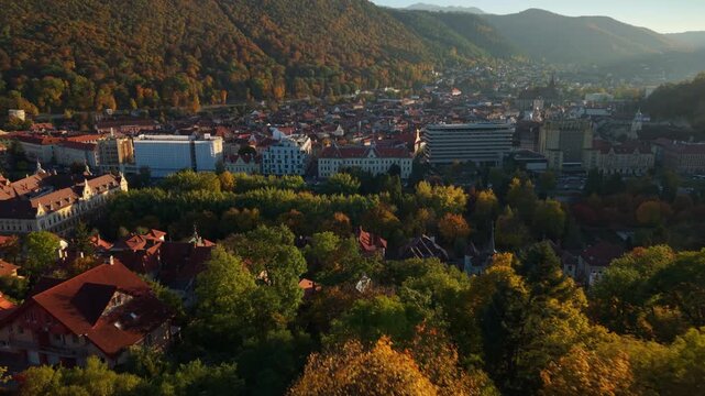 Drone shot of Brasov center at sunset in autumn 2025