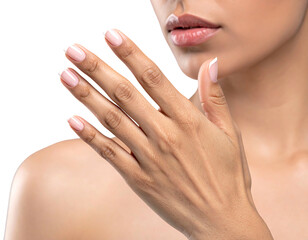 Close-up of a hand with elegant French manicure against a dark background, focus on skin and well-groomed nails
