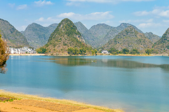 Quyang Lake (Quyanghu)  karst peaks landscape reflection in water in Baise city, Guangxi province, China