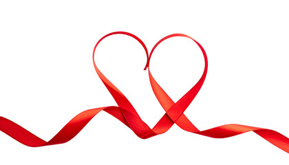 A vibrant red ribbon artfully shaped into a heart, set against a stark black background